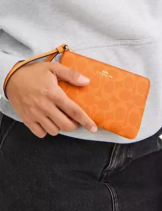 Coach Corner Zip Wristlet In Signature Canvas
