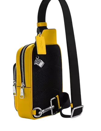 Coach Racer Sling Pack In Signature Canvas With Charms